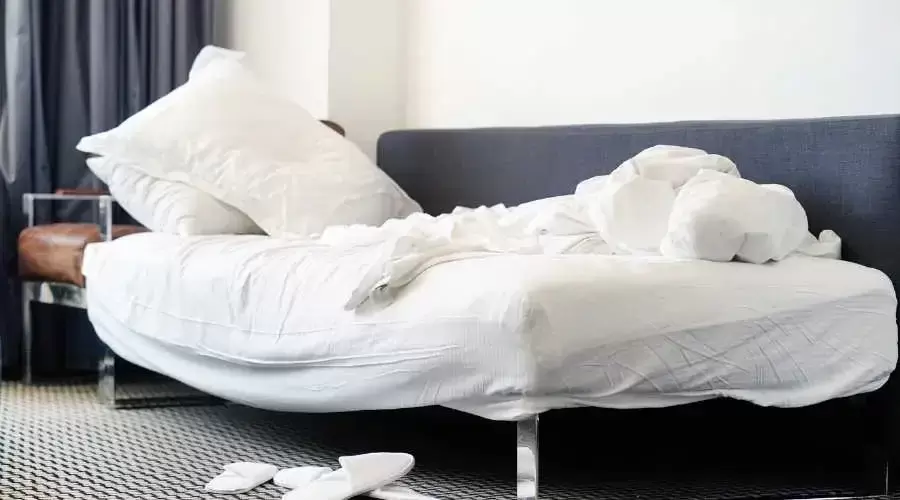 a messy white bed